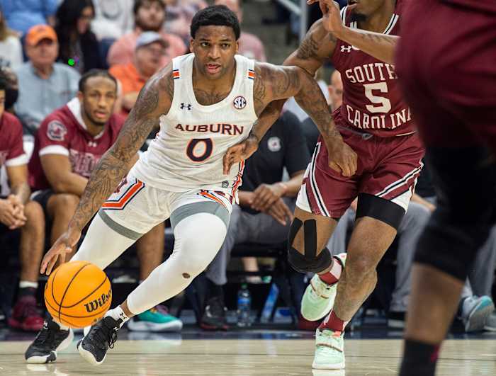 Auburn Tigers guard K.D. Johnson (0) drives the ball as Auburn Tigers men's basketball faces South Carolina Gamecocks at Neville Arena in Auburn, Ala., on Saturday, March 5, 2022.